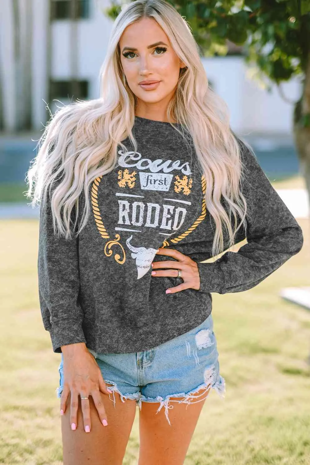 Mineral Washed COW'S FIRST RODEO Round Neck Raglan Sleeve Sweatshirt